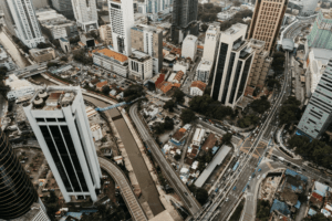Aerial view of a bustling city with tall buildings and busy roads