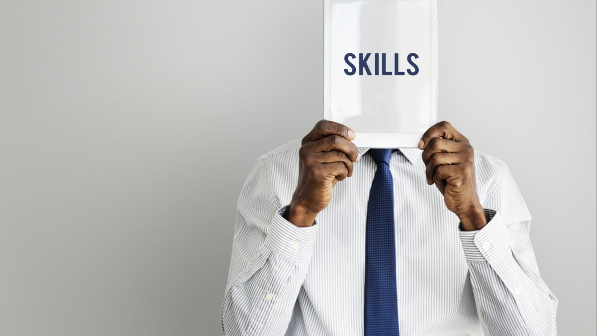 adult,african descent,aptitude,artistry,businessman,businessmen,cleverness,device,digital,digital device,digital tablet,display,expertness,front,gadget,hands,hidden,holding,human resources,intelligence,isolated,job,man,men,occupation,person,presenting,professional,proficiency,promote,recruit,recruiting,recruitment,screen,show,showing,skill,tablet,talent,technology,tie,word