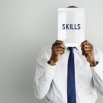 adult,african descent,aptitude,artistry,businessman,businessmen,cleverness,device,digital,digital device,digital tablet,display,expertness,front,gadget,hands,hidden,holding,human resources,intelligence,isolated,job,man,men,occupation,person,presenting,professional,proficiency,promote,recruit,recruiting,recruitment,screen,show,showing,skill,tablet,talent,technology,tie,word