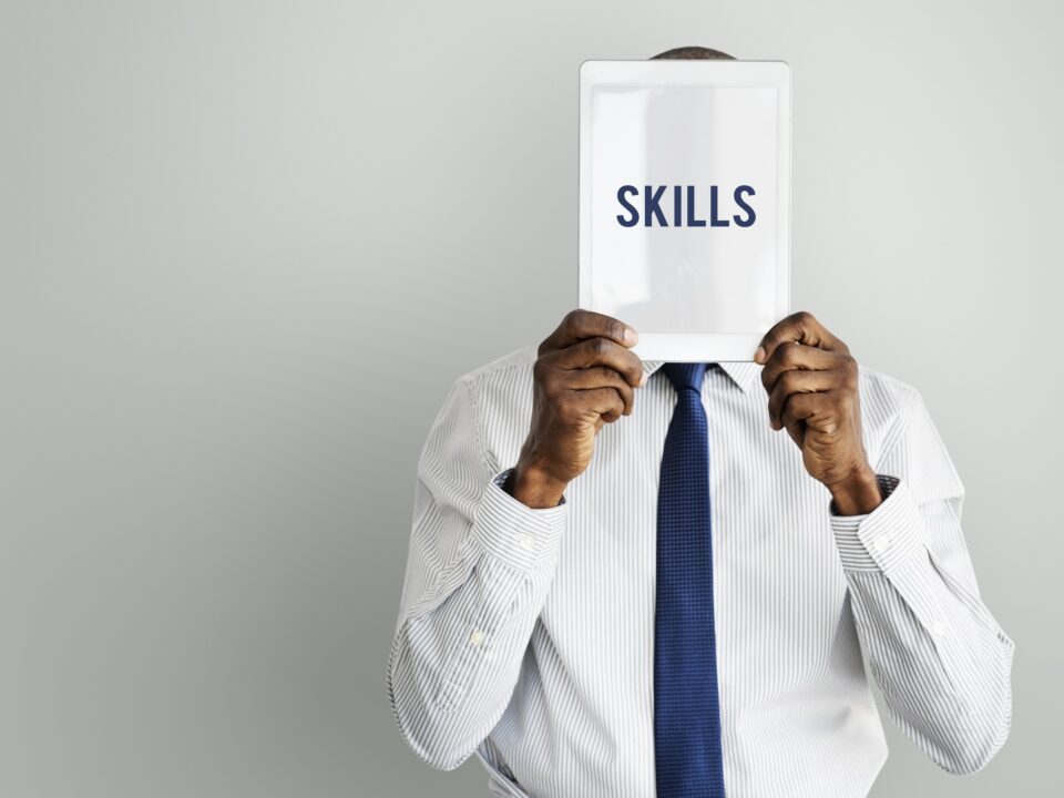 adult,african descent,aptitude,artistry,businessman,businessmen,cleverness,device,digital,digital device,digital tablet,display,expertness,front,gadget,hands,hidden,holding,human resources,intelligence,isolated,job,man,men,occupation,person,presenting,professional,proficiency,promote,recruit,recruiting,recruitment,screen,show,showing,skill,tablet,talent,technology,tie,word