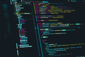 Image of codebase on a monitor displaly, custom software development