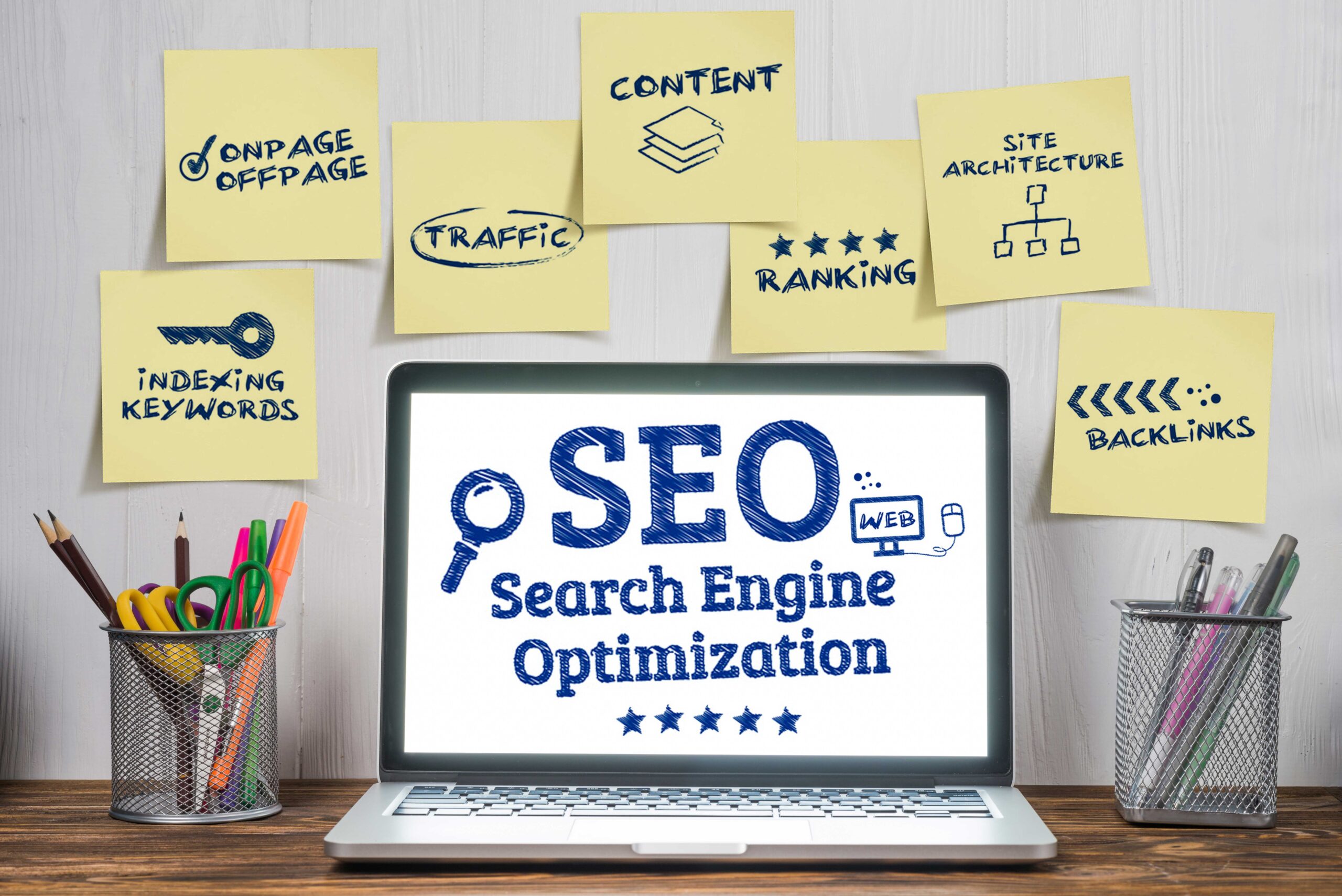 laptop with search engine optimization (seo) notes